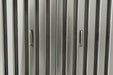 Stono Outdoor Living Close-up of evenly spaced vertical metallic panels with two recessed handles on the Blaze 48-Inch Stainless Steel Vent Hood (2000 CFM, BLZ-48-VHOOD) by Blaze. The surface features a brushed steel finish.