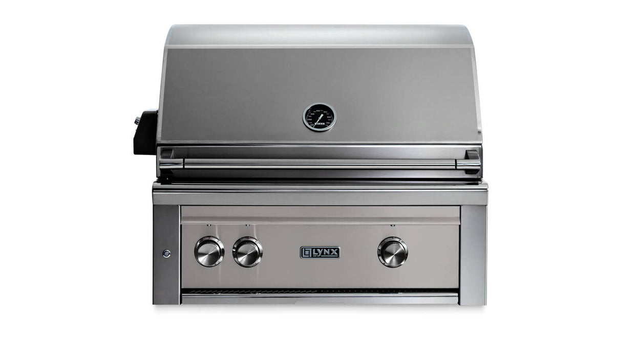Stono Outdoor Living The Lynx 30" Built-In Grill (L30TR-LSNG) in limestone features stainless steel construction, three control knobs, a closed lid with temperature gauge, rotisserie, Trident™ burner, and the Lynx logo on the front.