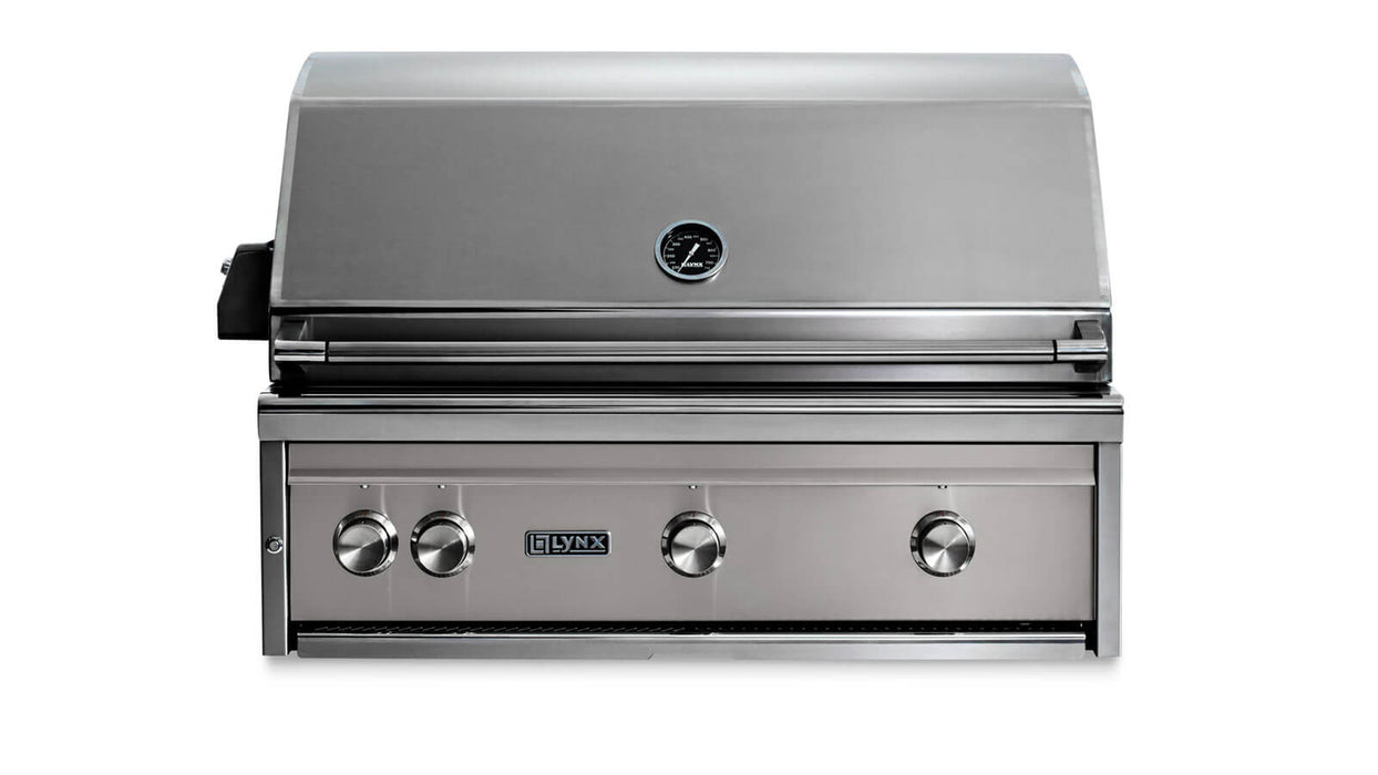Stono Outdoor Living The Lynx 36" Built-In Grill w/ Rotisserie in Limestone (L36R-3-LSNG) features stainless steel construction, four control knobs, a built-in hood thermometer, and the Lynx logo—an ideal choice for your outdoor kitchen.