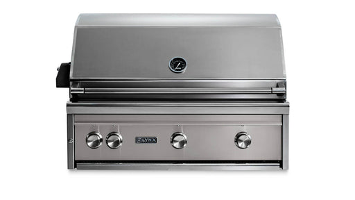 Stono Outdoor Living The Lynx 36" Built-In Grill w/ Rotisserie in Limestone (L36R-3-LSNG) features stainless steel construction, four control knobs, a built-in hood thermometer, and the Lynx logo—an ideal choice for your outdoor kitchen.