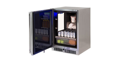 Stono Outdoor Living The Lynx 24" Outdoor Refrigerator Freezer (LN24REFC) by Lynx is shown open, with shelves stocked with drinks, dairy, apples, and carrots. Blue interior lighting adds a sleek touch for any outdoor kitchen.