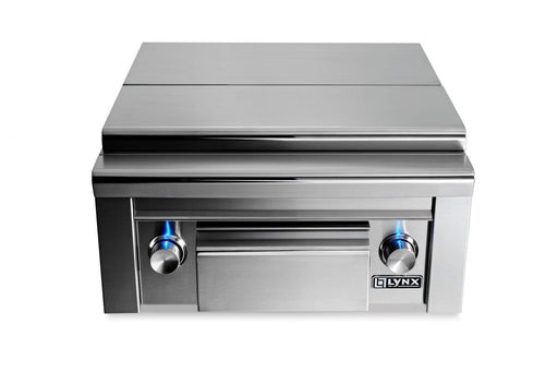 Stono Outdoor Living The Lynx Double Side-by-Side Burners (LSB2PC-1-NG) features stainless steel construction, two brass burners, a maple cutting board, a storage drawer, and blue-lit control knobs—ideal for any outdoor kitchen.
