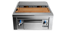 Stono Outdoor Living The Lynx Double Side-by-Side Burners (LSB2PC-1-NG) feature dual brass burners with two control knobs, a maple cutting board and drawer, griddle surface, blue LED-lit knobs, and the Lynx logo on the front—perfect for any outdoor kitchen.