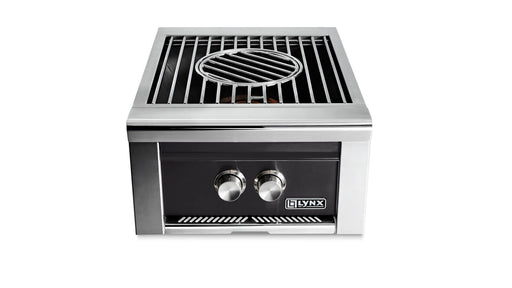 Stono Outdoor Living The Lynx Power Burner in Obsidian (LPB-OBNG) is a stainless steel outdoor grill featuring two control knobs, a rectangular surface with a circular center grate, and the Lynx brand displayed on the front.