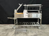 Stono Outdoor Living The Tagwood BBQ Argentine Santa Maria Wood Fire & Charcoal Grill - BBQ26SS by Tagwood BBQ, made of 304 stainless steel, features racks, hooks, a crank system, and wheels. Some parts are detached and shown nearby on a plain black backdrop over concrete.