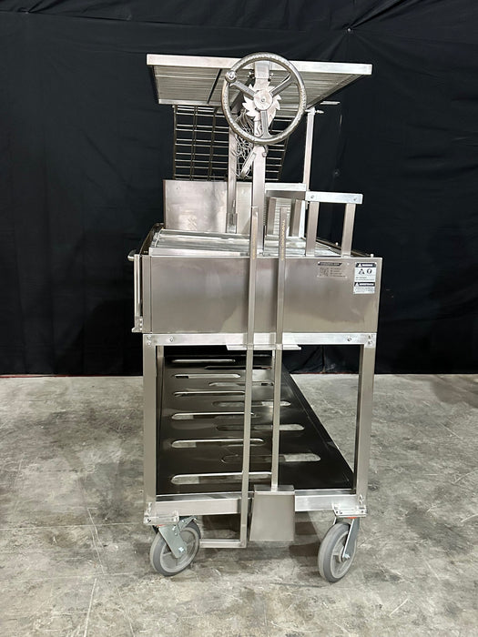 Stono Outdoor Living The Tagwood BBQ Argentine Santa Maria Wood Fire & Charcoal Grill - BBQ26SS, featuring a 304 stainless steel cart with wheels, metal shelves, and a hand crank, is set against a black backdrop on a concrete floor.