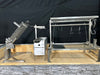 Stono Outdoor Living The Tagwood BBQ Basement Grill - BBQ94SS by Tagwood BBQ features three large SS 304 stainless steel clamp grills with adjustable racks and hooks, set on a stone and tile platform for an impressive basement barbecue space.