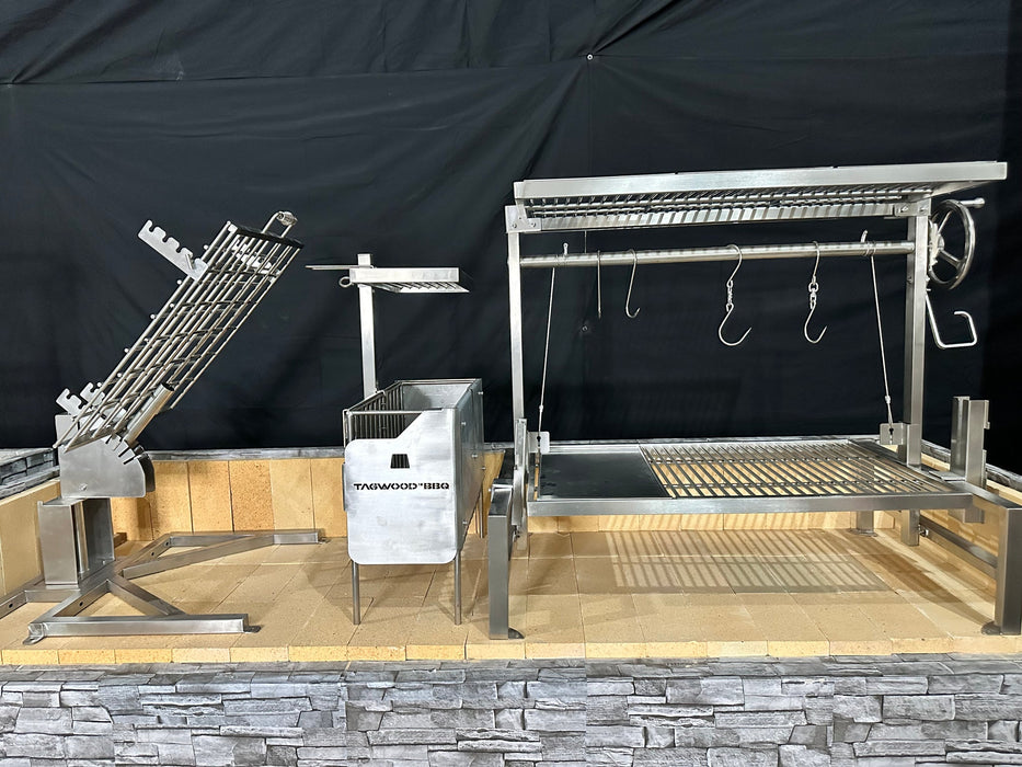 Stono Outdoor Living The Tagwood BBQ Basement Grill - BBQ94SS by Tagwood BBQ features three large SS 304 stainless steel clamp grills with adjustable racks and hooks, set on a stone and tile platform for an impressive basement barbecue space.