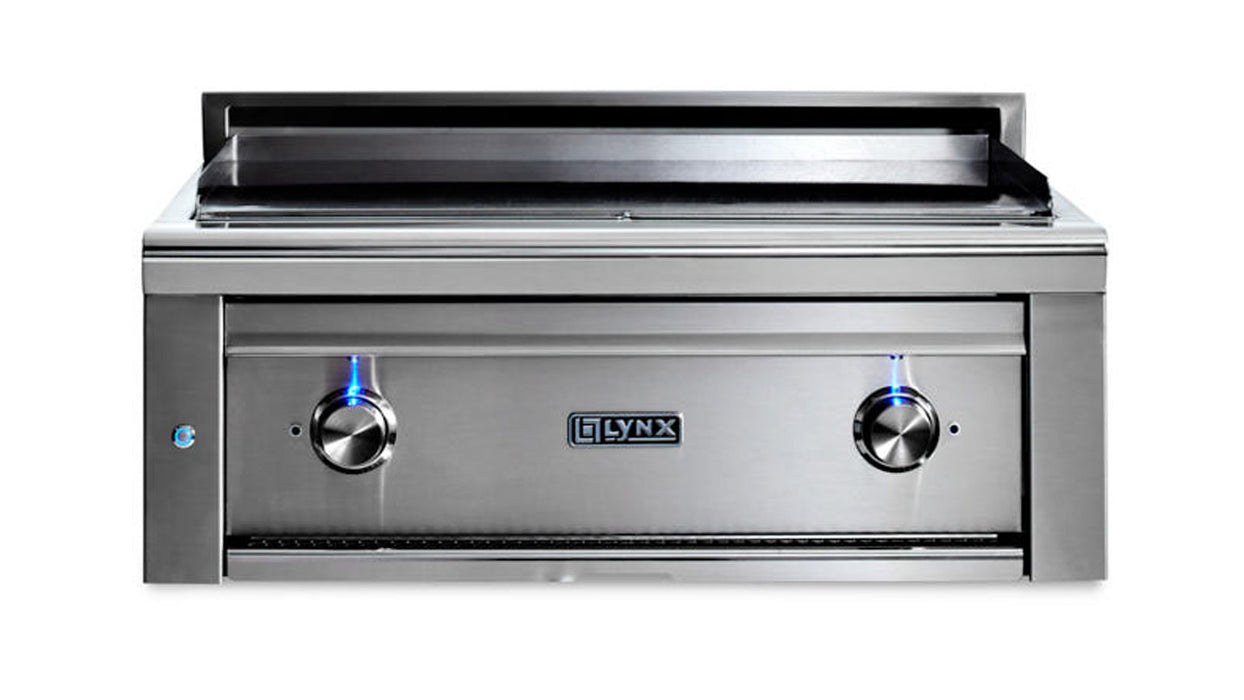 Stono Outdoor Living The Lynx 30” Asado Built-In Grill in stainless steel (L30AG-NG) features infrared burners, two illuminated control knobs, and a flat grilling surface—adding elegance to any luxury outdoor kitchen, shown on a white background.