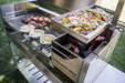 Stono Outdoor Living The Tagwood BBQ Height Adjustable Griddle - BBQ54SS lets you grill sliced vegetables on an elevated tray while heating meat and sauces on the main surface, making it a perfect accessory for your Tagwood BBQ grill.