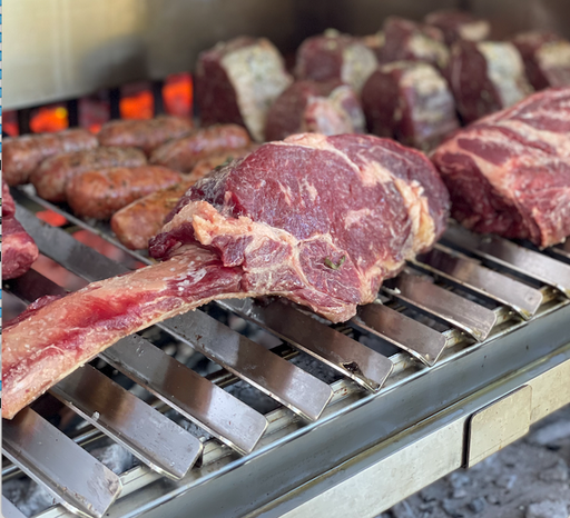 Stono Outdoor Living Large cuts of beef, sausages, and steaks sizzle on the Tagwood BBQ V-Shape Grill Grate for BBQ23SS & BQ25SS grills, delivering perfect grill marks and smoky flavor—ideal for any outdoor kitchen experience.