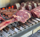 Stono Outdoor Living Large cuts of beef, sausages, and steaks sizzle on the Tagwood BBQ V-Shape Grill Grate for BBQ23SS & BQ25SS grills, delivering perfect grill marks and smoky flavor—ideal for any outdoor kitchen experience.