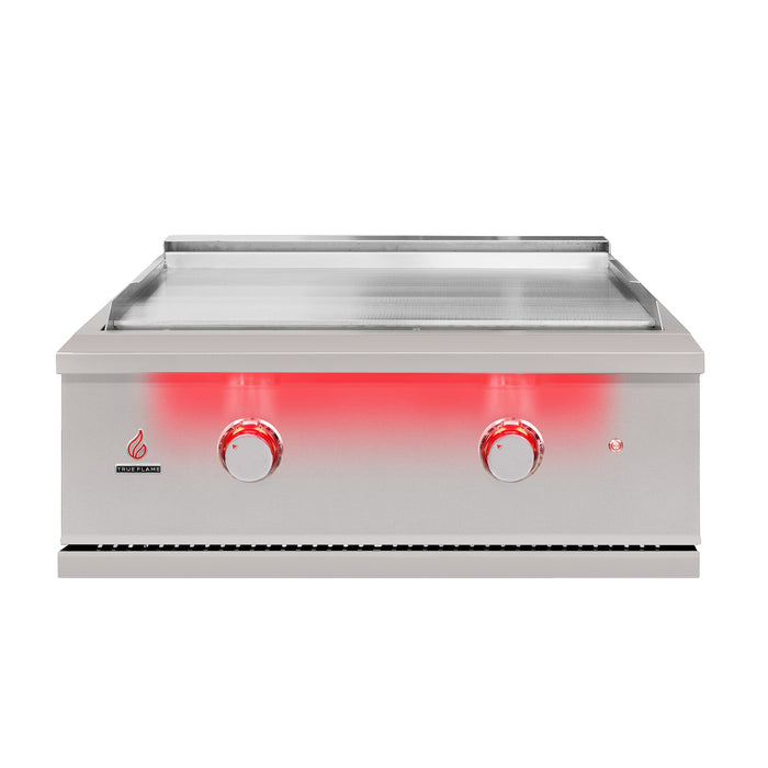 Stono Outdoor Living The TrueFlame 30" Built-In Natural Gas Grill Griddle (TFG30) features a stainless steel flat-top, two red-lit control knobs, and a power indicator light on the front panel, shown against a white background.
