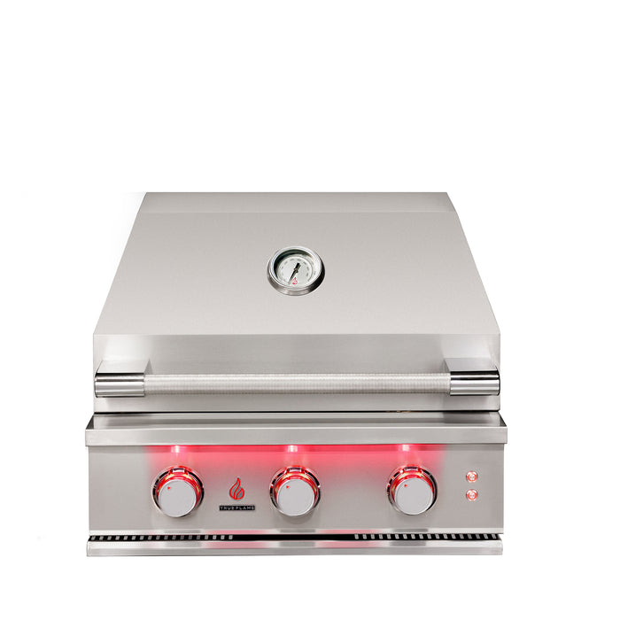 Stono Outdoor Living The TrueFlame 25" 3-Burner Built-In Propane Gas Grill (TF25L) by TrueFlame features commercial-grade stainless steel, three red-lit control knobs, a closed lid, and a built-in temperature gauge centered on the lid.