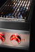 Stono Outdoor Living A close-up of the TrueFlame Gas Double Side Burner - TFSB2L by TrueFlame shows two blue burners lit under a metal grate, with illuminated control knobs below indicating both side burners are on—ideal for any outdoor kitchen.