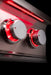 Stono Outdoor Living Close-up of two TrueFlame Gas Double Side Burner (TFSB2L) stainless steel knobs glowing red against a dark background, creating a modern, sleek look—perfect for any stylish outdoor kitchen.