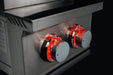 Stono Outdoor Living Close-up of two stainless steel control knobs on the TrueFlame Gas Double Side Burner - TFSB2L, illuminated in red to show they're on. The reflective finish stands out against a dark background—perfect for any outdoor kitchen setup.