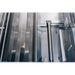 Stono Outdoor Living Close-up of 304 stainless steel components inside the TrueFlame E Series 32" 4-Burner Built-In Propane Gas Grill (TFE32L), featuring perforated panels and smooth metallic surfaces characteristic of commercial-grade grills.