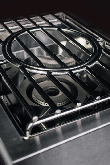 Stono Outdoor Living Close-up of the TrueFlame Propane Gas Power Burner - TFPBL by TrueFlame, featuring stainless steel construction, metal grates, and visible burner rings—ideal for an outdoor kitchen—set against a dark background.