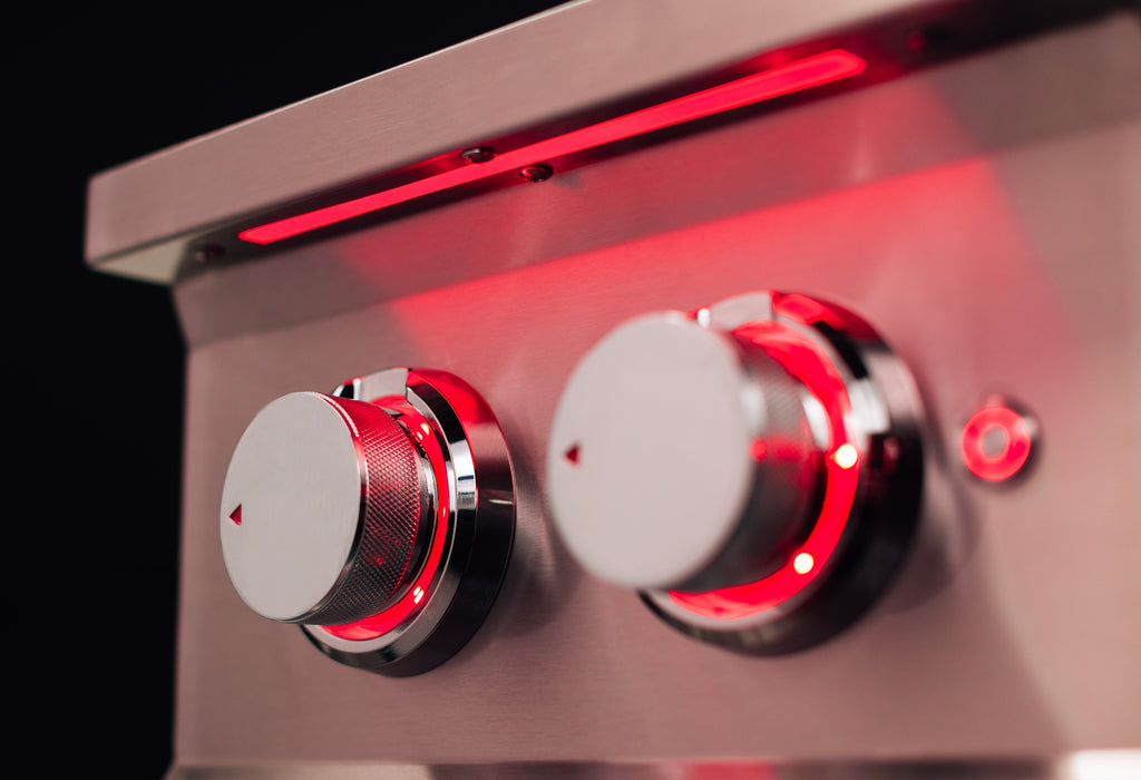 Stono Outdoor Living Close-up of two metallic control knobs on the TrueFlame Propane Gas Power Burner (TFPBL) by TrueFlame, with red LED-lit indicators and a nearby round button—ideal for any outdoor kitchen side burner setup.