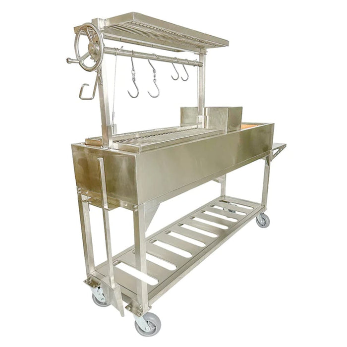 Stono Outdoor Living The Tagwood BBQ Argentine Santa Maria Wood Fire & Charcoal Grill (BBQ06SS) is a large 304 stainless steel grill with wheels, meat hooks, hand crank, and lower storage rack for authentic outdoor barbecuing.