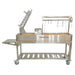 Stono Outdoor Living The Tagwood BBQ Argentine Santa Maria Wood Fire & Charcoal Grill (BBQ06SS) by Tagwood BBQ features 304 stainless steel, a side shelf, hanging hooks, grilling racks, wheels, a storage shelf below, and an Argentine-style cooking area with a partially open lid.