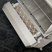 Stono Outdoor Living Close-up of the Twin Eagles Wi-Fi Controlled 36-Inch Built-In Stainless Steel Pellet Grill & Smoker with Rotisserie (TEPG36R) from Twin Eagles, shown with pellets beside the grilling surface—ideal outdoor cooking gear for any enthusiast.