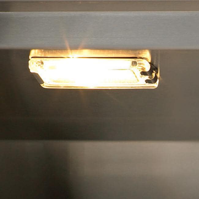 Stono Outdoor Living A close-up of a small rectangular light under a dark shelf emits bright, warm light—perfect for late-night grilling on the Twin Eagles 42-Inch 3-Burner Built-In Natural Gas Grill with Infrared Rotisserie Burner (TEBQ42R-CN).