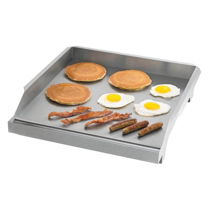 Stono Outdoor Living The Twin Eagles 18-Inch Griddle Plate for Power Burners (TEGP18-PB) by Twin Eagles, made of 304 stainless steel, is shown holding pancakes, sunny-side-up eggs, bacon strips, and sausage links neatly arranged on its surface.