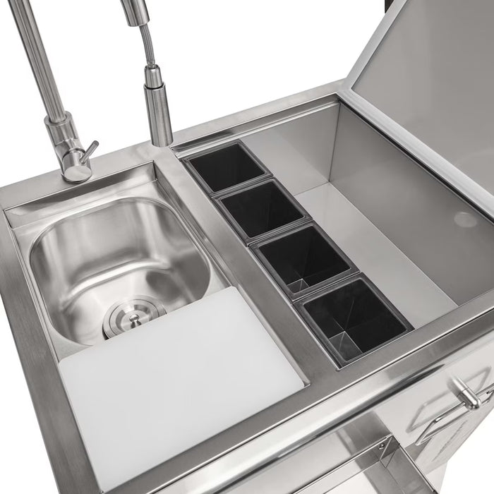 Stono Outdoor Living The Coyote 30" Refreshment Center w/ Sink, Faucet, and DI Cooler (C3RC) features a small sink, commercial faucet, white cutting board, four compartments, and an open refrigerated storage bin—perfect for outdoor kitchens.