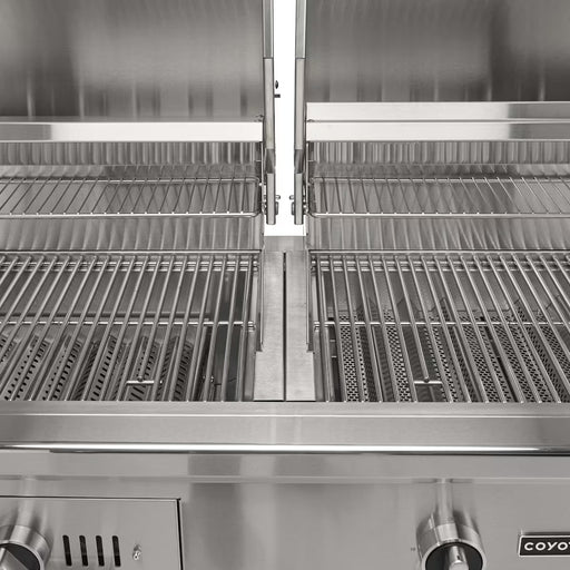 Stono Outdoor Living A close-up of the Coyote 50" Hybrid Grill (C3HY50NG) shows open lids, clean dual grilling racks, burners, control knobs, and part of the brand logo—highlighting its built-in natural gas and charcoal cooking versatility.