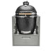 Stono Outdoor Living A Coyote Asado Smoker Insert Sleeve (C3SLV) houses a black ceramic kamado grill with Asado Smoker cooking grids, set in a stainless steel outdoor kitchen frame with a pull-out storage drawer below.