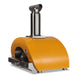 Stono Outdoor Living The Coyote 30" Hybrid Multi-Fuel Outdoor Oven in Yellow (C1PZ30HYLP) has a bright yellow curved exterior, stainless steel base, tall chimney, and temperature gauge—ideal for countertop use and adding wood-fired flavor to your outdoor kitchen.