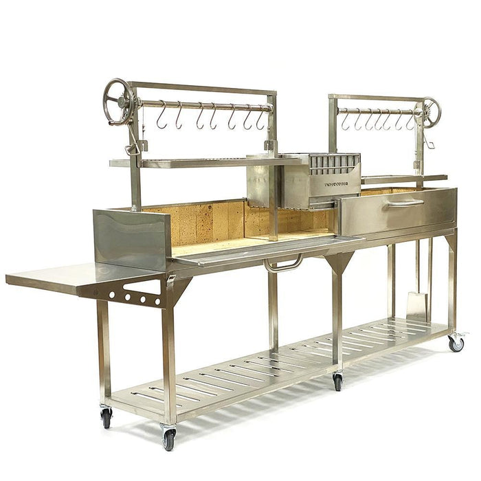 Stono Outdoor Living The Tagwood BBQ Double Argentine Santa Maria Wood Fire & Charcoal Grill - BBQ04SS by Tagwood BBQ features wheels, side trays, hooks, adjustable racks, a lower shelf, multiple compartments, and a modern stainless steel design for open fire grilling.