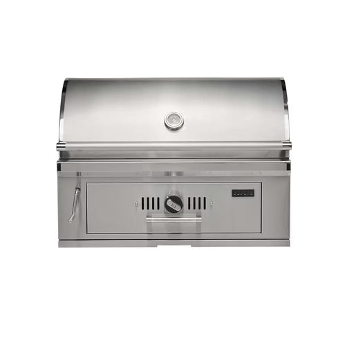 Stono Outdoor Living The Coyote 36" Charcoal Grill, Built-in (C3CH36) by Coyote is a stainless steel outdoor grill with a closed curved lid, top temperature gauge, left-side handle, and front control knob and vent. Shown isolated on a white background.
