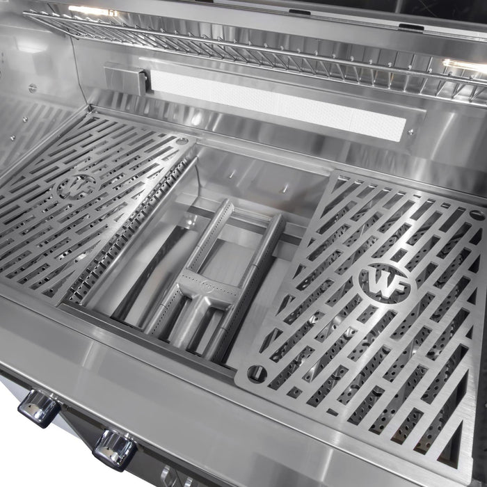 Stono Outdoor Living Close-up of the Wildfire Ranch Pro 30" Gas Grill by Wildfire Outdoor Living, showing its black stainless steel interior with two metal grates featuring diagonal slots and the WF logo, burners, control knobs, and a warming rack above.