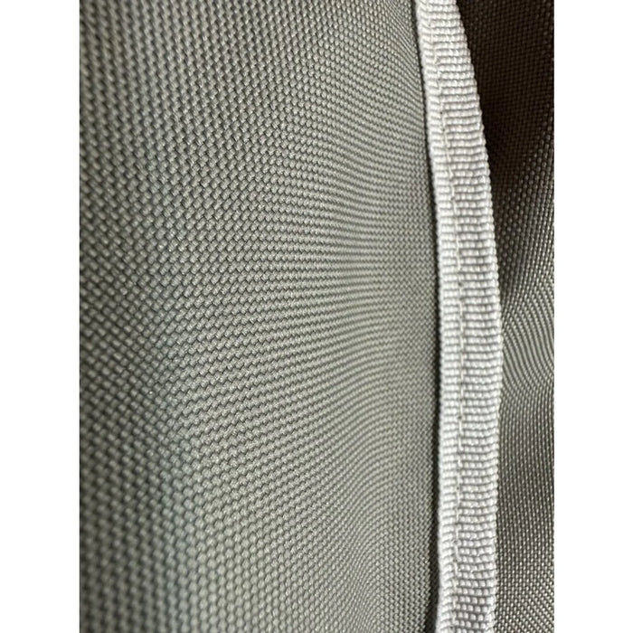 Stono Outdoor Living Close-up of the durable gray fabric with a white woven edge featured on the Coyote Cover for Electric Grill (CCVREL-BIG) by Coyote, showcasing its textured weave designed for weather-resistant outdoor protection.