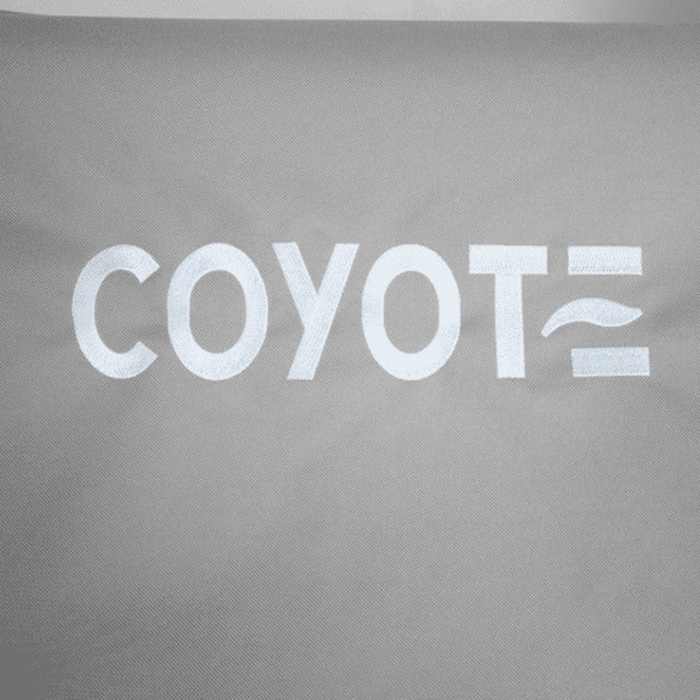 Stono Outdoor Living White text on a gray fabric background reads "COYOTE," with the final E as three lines—the middle wavy—reflecting the durability and style of the Coyote Cover for Electric Grill - CCVREL-BIG, designed to protect your outdoor grill.