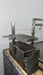 Stono Outdoor Living The Tagwood BBQ Height Adjustable Secondary Grate for the BBQ09SS Grill by Tagwood BBQ adds versatility and extra cooking space to your 304 stainless steel grill, designed for mounting on a stone or brick base against a light-colored wall.