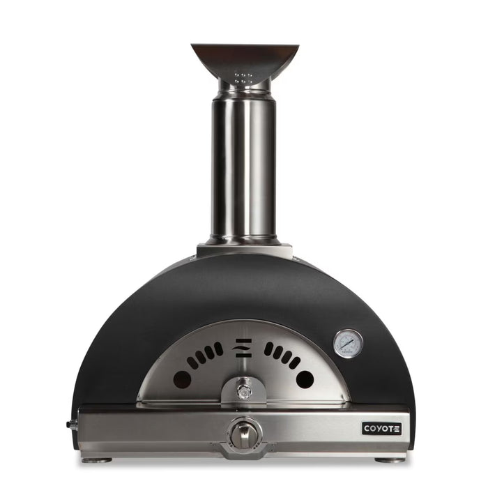 Stono Outdoor Living Front view of the Coyote 30" Hybrid Multi-Fuel Outdoor Oven in Matte Black (C1PZ30HMBLP), featuring a chimney, built-in thermometer, vents, and a curved door with handle—ideal for wood-fired flavor in your outdoor kitchen.