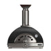 Stono Outdoor Living Front view of the Coyote 30" Hybrid Multi-Fuel Outdoor Oven in Matte Black (C1PZ30HMBLP), featuring a chimney, built-in thermometer, vents, and a curved door with handle—ideal for wood-fired flavor in your outdoor kitchen.