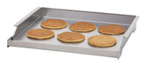 Stono Outdoor Living The Delta Heat Griddle Plate - DHGP18 by Delta Heat holds six evenly spaced golden-brown pancakes on its stainless steel surface, angled against a white background.