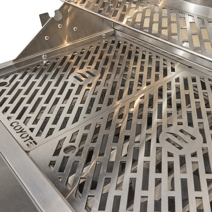 Stono Outdoor Living Close-up of a premium Coyote 36" SL-Series Grill grate in stainless steel, featuring geometric and flame cutouts. The Coyote brand stands out on this built-in natural gas grill, ideal for outdoor kitchens. Model: C3SL36NG.