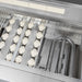 Stono Outdoor Living Close-up of the Delta Heat 32-Inch 3-Burner Built-In Natural Gas Grill (DHBQ32R-DN) interior, featuring stainless steel components, ceramic briquettes, grates, and an infrared rotisserie burner from Delta Heat.