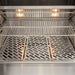 Stono Outdoor Living Close-up of the Coyote 36" Pellet Grill - C2P36 shows its stainless steel interior with two lights, metal warming rack, patterned grill grate, and clean surfaces that showcase advanced digital controls for seamless outdoor cooking.
