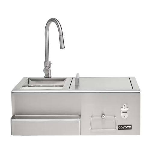 Stono Outdoor Living The Coyote 30" Refreshment Center w/ Sink, Faucet, and DI Cooler (C3RC) boasts a tall faucet, built-in sink, covered compartment, paper towel holder, bottle opener & drawer—an essential outdoor kitchen station proudly displaying the Coyote logo.