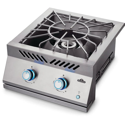 Stono Outdoor Living The Napoleon Built-In 700 Series Propane Gas Power Burner (BIB18PBPSS) features stainless steel construction, two control knobs with blue LED lights, a heavy-duty grate, and the Napoleon logo on the front panel.